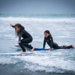 Yakutat Surf Club participants practice their form during the kickoff July camp. Standing up on a surfboard is difficult, and youth participants worked hard to challenge themselves during the week-long event. (Courtesy Photo / Bethany Sonsini Goodrich)