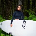 Zoé Alliah Bulard steps out of the Tongass and onto Cannon Beach. Bulard describes how surfing offers refuge from daily anxieties and the pride of catching her first waves with Yakutat Surf Club. (Courtesy Photo / Bethany Sonsini Goodrich)
