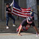 Marine Corps and Army veteran Darren Hafford does pushups in front of the Alaska State Capitol as part of a fundraising effort where Hafford is traveling to every state capitol building and doing pushups in front of them to raise awareness and money for veteran suicide prevention. Juneau is his 49th, with only Hawaii remaining. (Michael S. Lockett / Juneau Empire)