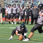 Wallace Adams winds up to put the football through the uprights against Dimond High School. (Ben Hohenstatt / Juneau Empire)
