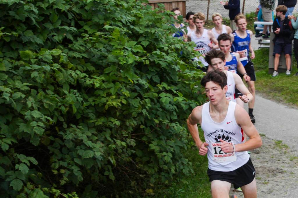 Runners round a turn during a high school cross country race at Savikko Park on Saturday, Aug. 21, 2021. (Michael S. Lockett / Juneau Empire)