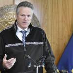 Gov. Mike Dunleavy, seen here at an Aug. 16, news conference, announced Thursday the state was taking steps to help Alaska's hospitals deal with the strain of a spike in COVID-19 cases. (Peter Segall / Juneau Empire file)