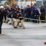 Army divers, in the khaki pants, compete against a team of Coast Guardsmen in the tug of war, one of the inter-vessel competitions during this years Buoy Tender Roundup at Sector Juneau, on Wednesday, Aug. 25, 2021. (Michael S. Lockett / Juneau Empire)