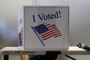 A voter fills out their ballot in person at the Mendenhall Valley Public Library on Oct. 6, 2020. The library was the site of one of the voting centers during the City and Borough of Juneau's by-mail municipal election.  Soon, city officials will mail ballots for local elections to all registered voters in the City and Borough of Juneau. Residents must act by Sept. 5 to register to vote or update personal information. Residents who prefer to vote in person can do so early or on election day at designated voting centers. (Ben Hohenstatt / Juneau Empire File)