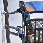 After a series of delays caused by weather and COVID-19, Crystal Worl and her team of apprentice artists begin installing Juneaus newest public art installation on Aug. 30. (Peter Segall/Juneau Empire)