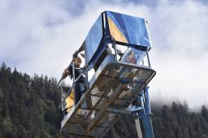 With the sun shining brightly on Monday, Aug. 30, Tlingit and Athabascan artist, designer, and activist Crystal Kaakeeyaa Worl and her team of apprentices started installing a new mural on the south wall of the Marine Parking garage, the structure on which the downtown branch of Juneau's public library sits. The mural depicts Elizabeth Kaaxgal.aat Peratrovich, a Tlingit civil rights icon. (Peter Segall/Juneau Empire)