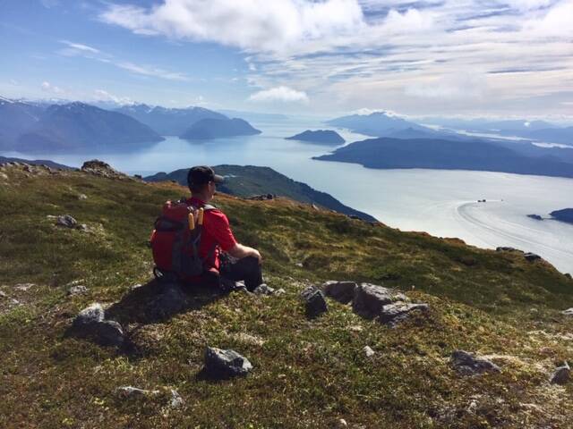 A friend enjoying the view from the top of West Peak (looking south), writes Bill Andrews of this Sept. 1 photo. (Courtesy Photo / Bill Andrews)