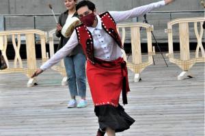 Jay Dóosh Tláa Zeller dances in celebration in front of the newly installed mural depicting Elizabeth Kaaxgal.aat Peratrovich, a Tlingit civil rights icon, on Sept. 1. Zeller served as the Sealaska Heritage Institue project coordinator for the mural, which was done by Tlingit and Athabascan artist, designer, and activist Crystal Kaakeeyaa Worl and her team of apprentices. (Dana Zigmund/Juneau Empire)