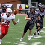 East Anchorages Andrew Montenegro and a pack of Huskies pursue a loose ball during an onside kick. The long roll left East with poor field position. Juneau capitalized on it with a sack for a safety. (Ben Hohenstatt / Juneau Empire)