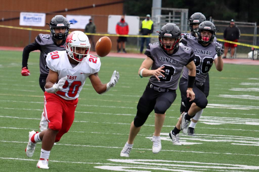 East Anchorages Andrew Montenegro and a pack of Huskies pursue a loose ball during an onside kick. The long roll left East with poor field position. Juneau capitalized on it with a sack for a safety. (Ben Hohenstatt / Juneau Empire)