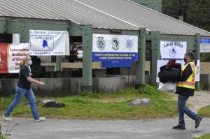 Unable to hold the usual Labor Day picnic, members of Juneau's Central Labor Council decided to hold a donation drive at Saviko Park instead. According to CLC President Kirk Perisich, seen here at right bringing donated clothes to be sorted on Monday, Sept. 6, 2021, donations had piled up within the first 20 minutes. (Peter Segall / Juneau Empire)