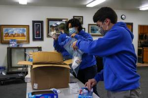 Michael S. Lockett / Juneau Empire 
AmeriCorps members pack emergency preparedness kits for Central Council of Tlingit and Haida Indian Tribes of Alaskas Tribal Emergency Operations Center as part of a day of service on Sept. 10, 2021.