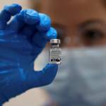 A bill aimed at helping Alaska's hospitals died Monday after provisions were added by lawmakers barring vaccine mandates. In this file photo, a nurse holds a phial of the Pfizer-BioNTech COVID-19 vaccine at Guy’s Hospital in London, Tuesday, Dec. 8, 2020.  (AP Photo/Frank Augstein, Pool)