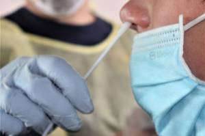 A young patient is tested for COVID-19. More testing sites will come online as the city fends off the worst of the delta variant, said a city official. (Dana Zigmund / Juneau Empire)