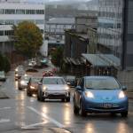 A line of electric vehicles makes its way up Main Street Saturday, Sept. 26, 2020. (Ben Hohenstatt / Juneau Empire File)