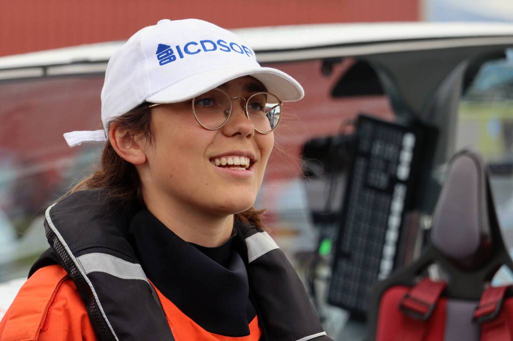 Zara Rutherford smiles outside her aircraft while talking to a small crowd that gathered at Ward Air to greet her. Rutherford said the public nature of her effort to fly around the world means that there is often a group gathered when she lands. Its really nice seeing all of these people, she said. (Ben Hohenstatt / Juneau Empire)