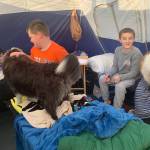 Rhiannon Wenzel, Jonah Hurst, and Jackson Pearson spend the night in a tent at Fishcamp (Vivian Faith Prescott / For the Capital City Weekly)