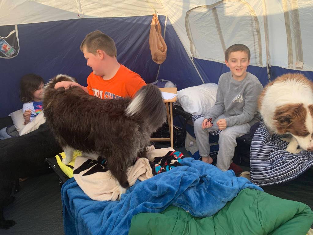 Rhiannon Wenzel, Jonah Hurst, and Jackson Pearson spend the night in a tent at Fishcamp (Vivian Faith Prescott / For the Capital City Weekly)