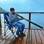 Jackson Pearson tries out a didgeridoo, Mickeys Fishcamp in Wrangell. (Vivian Faith Prescott / For the Capital City Weekly)