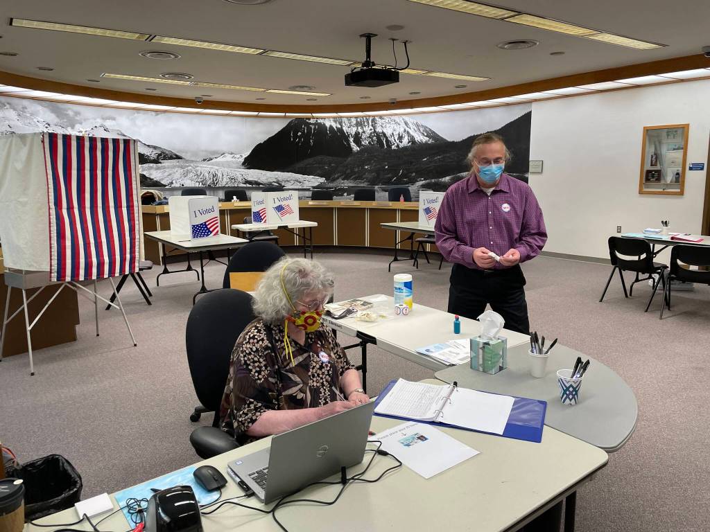 Michael S. Lockett / Juneau Empire 
Election workers Nora Laughlin and Bob Laurie staff the City Hall election station on the last day of voting for Juneaus municipal election, Oct. 5, 2021.