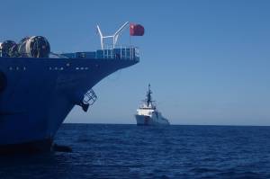 Crews aboard U.S. Coast Guard Cutter Bertholf prepare to board a fishing vessel flying the flag of the Peoples Republic of China in the North Pacific on Sep. 21, 2021. (Courtesy photo / U.S. Coast Guard)