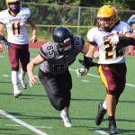 Brandon Campbell chases down a Dimond ball carrier during an Aug. 21 game. The Juneau Huskies and Dimond Lynx will face off again on Saturday. (Ben Hohenstatt / Juneau Empire File)