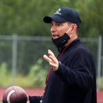 Coach Rich Sjoroos addresses the Juneau Huskies during practice ahead of Juneaus first home game of the season. Sjoroos was recently named Cook Inlet Conference Coach of the Year. Sjoroos said he is fortunate to be surrounded by great players and coaches. (Ben Hohenstatt / Juneau Empire)