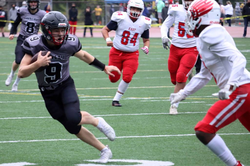 Payton Grant, a junior wide receiver, makes a move following a reception against Bettye Davis East Anchorage High School. (Ben Hohenstatt / Juneau Empire)
Payton Grant, a junior wide receiver, makes a move following a reception against Bettye Davis East Anchorage High School. (Ben Hohenstatt / Juneau Empire)