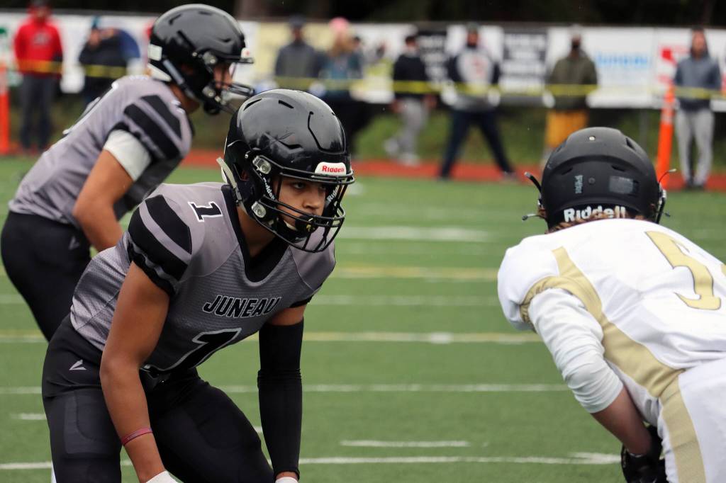 Jarrell Williams, a junior defensive back, stares down his assignment prior to the play during the Huskies home win against South Anchorage. (Ben Hohenstatt / Juneau Empire)