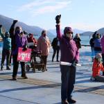 Ben Hohenstatt / Juneau Empire File 
Masked people raise their fists in the air during the 2020 Juneau womens march and rally at Mayor Bill Overstreet Park.