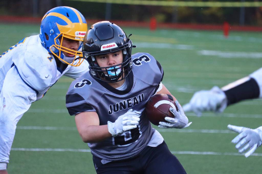 Senior running back Gaby Soto makes his way toward the end zone. Soto scored three touch downs on Juneaus second-round playoff game against Bartlett High School. (Ben Hohenstatt / Juneau Empire)