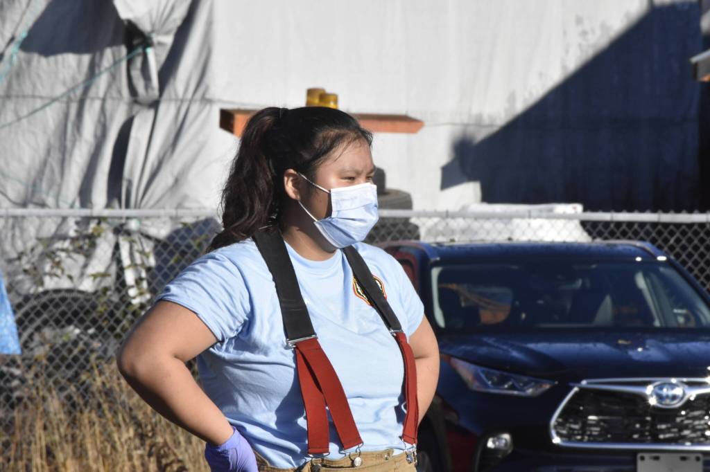Sarah Taube, 17 of Yaakoosgé Daakahídi High School, rests between exercises in the yard at the Hagevig Regional Fire Training Center on Saturday, Oct. 16, 2021. (Peter Segall / Juneau Empire)
