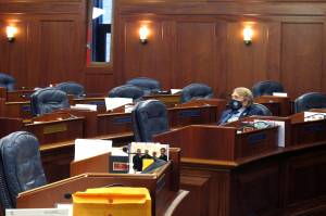 Alaska state Rep. Laddie Shaw, an Anchorage Republican, waits for the start of a so-called technical session on the House floor, Wednesday, Oct. 20, 2021, in Juneau, Alaska. The fourth special legislative session of the year began Oct. 4, in Juneau, but there has been little action at the Capitol and little progress toward resolving Alaskas fiscal issues. (AP Photo / Becky Bohrer)
