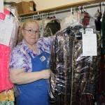 Kathy Buell, owner of Balloons by Night Moods, shows off a pirate costume on Oct. 27. The costume is one of more than 2,000 on hand for rental. (Dana Zigmund/Juneau Empire)