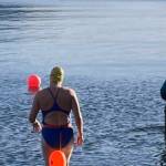 Cheryl Fellman enters the chilly waters of Auke Bay. Freeman is on the verge of becoming one of only 43 Americans — and 422 people worldwide — to swim an official Ice Mile. (Courtesy photo/Cheryl Fellman)