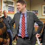 Nicholas Begich III, middle, speaks with supporters ahead of announcing his plans to run for Alaska's lone U.S. House seat on Thursday, Oct. 28, 2021, in Wasilla, Alaska. Begich, a Republican, plans to run for the seat that has been held since 1973 by Republican Rep. Don Young. (AP Photo / Mark Thiessen)