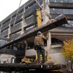 It took two forklifts, a large crane, a flatbed truck a team of workers to move the Wooshkeetaan Kootéeyaa (totem pole) to its new location inside the atrium of the State Office Building on Oct. 15. (Michael Penn / For the Jundeau-Douglas City Museum)