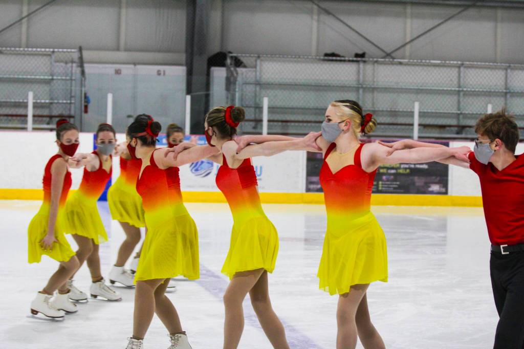 Michael S. Lockett / Juneau Empire 
Skaters for Juneau Skating Club Team Forget-Me-Not wheel around during a practice on Oct. 31, 2021 as they ready for an upcoming travel competition in California.