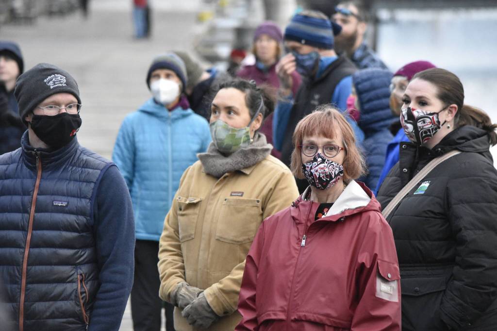 Peter Segall / Juneau Empire
Spectators gather on the Juneau waterfront on Friday, Nov. 5, 2021, for the opening of the first Rock Aakw Indigenous Music Festival. Attendees included Juneau Arts and Humanities Council executive director Nancy Decherney, center, in red. The JAHC is a supporter of the festival.