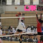 Thunder Mountain High School girls volleyball players Molly Brocious, center, #10, and Sydney Strong, left, #11, face off against Juneau Douglas High School: Yadaa.at Kalé player Ashley Laudert, #18, during the Region Five tournament in Ketchikan over the weekend. (Mackenzie Pahang / Kayhi Current)