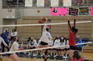 Thunder Mountain High School girls volleyball players Molly Brocious, center, #10, and Sydney Strong, left, #11, face off against Juneau Douglas High School: Yadaa.at Kalé player Ashley Laudert, #18, during the Region Five tournament in Ketchikan over the weekend. (Mackenzie Pahang / Kayhi Current)