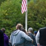 A couple embraces during the Sept. 11th Memorial Ceremony at Riverside Rotary Park on September 11, 2015. Over the last 19 years, the memorial has served as a location for the community to gather and reflect. (Michael Penn / Juneau Empire File)