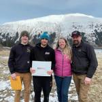 Courtesy photo
Colton Johns (center, with a blue hat) was awarded the JDHS hockey award named for Matthew Campbell. He stands with (from left to right) Brandon Campbell, Judy Campbell and Andrew Campbell.