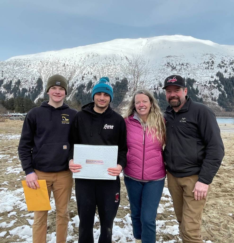 Courtesy photo
Colton Johns (center, with a blue hat) was awarded the JDHS hockey award named for Matthew Campbell. He stands with (from left to right) Brandon Campbell, Judy Campbell and Andrew Campbell.