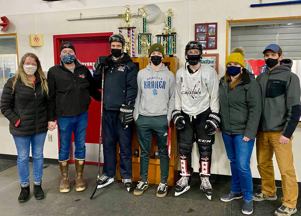 Courtesy Photo
Ike Puustinen (center, in hockey gear) was awarded the JDIA hockey club award named for Matthew Campbell. He is joined by (from left to right) Judy Campbell, her husband Andrew, coach Mike Bovitz, Brandon Campbell, his mom Shawna Puustinen and his dad Kevin Puustinen.