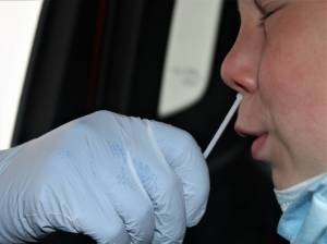 Dana Zigmund / Juneau Empire
An elementary school child gets a COVID-19 test at the Hegevig Regional Fire Training Center on Aug. 27. In early November, the Centers for Disease Control and Prevention approved the Pfizer vaccine for children ages 5 through 12. Previously, the vaccine had only been OKd for people 12 and older. The Juneau School district reported many COVID-19 cases in children who were not eligible to be vaccinated. In some cases, the positive tests led to classroom quarantines.