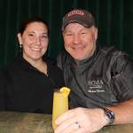 Chef Michael “MB” Brewer (right), and his wife, Jennry, share a toast to their new adventures at Roma Bistro on the Wharf on Sat. Nov. 13. The couple recently moved to Juneau to take on leadership roles at the Juneau Waterfront Restaurant Group, which includes Roma, The Hangar at the Wharf, The Alaska Fish and Chips Company, Pier 49, and Twisted Fish Company Alaska Grill. (Dana Zigmund/Juneau Empire)
