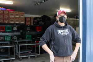 Michael S. Lockett / Juneau Empire File
Chris Shapp, executive director of the Southeast Alaska Food Bank, stands outside the food bank on Feb. 18, 2021 as a van full of food donations arrives. Schapp hopes more donations are in store for Saturday as the food bank holds its annual drive.