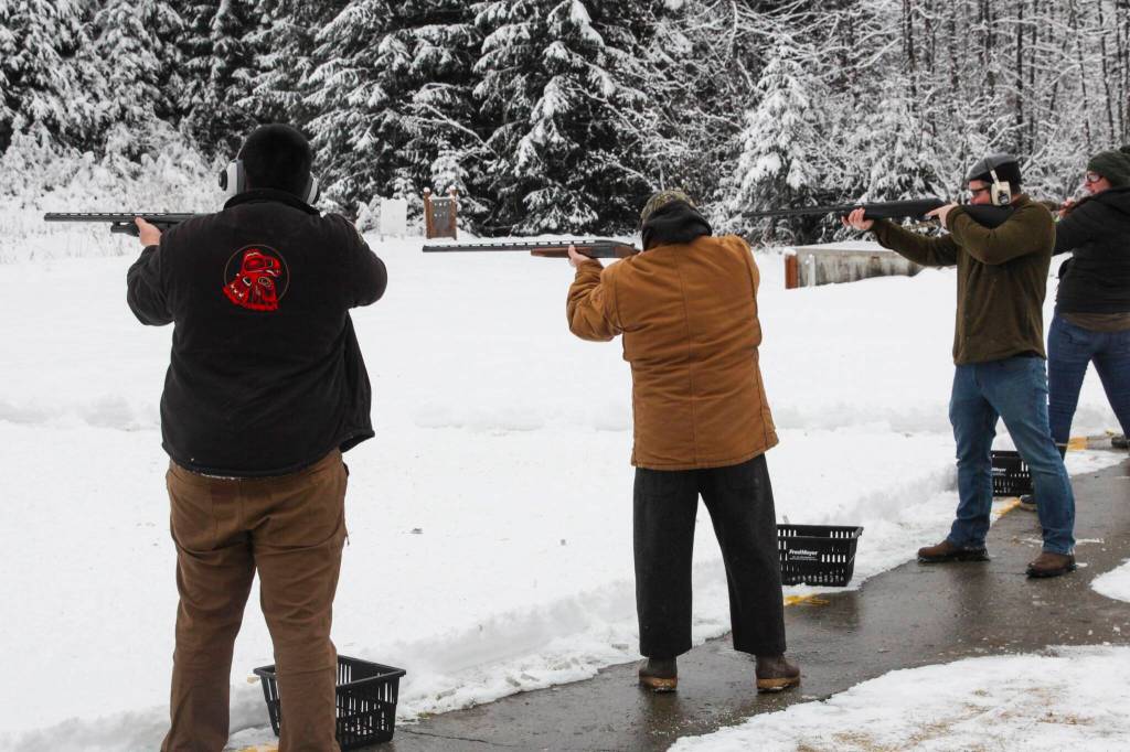 Shooters prepare to fire at a target during the Juneau Gun Clubs annual Turkey Shoot on Nov. 20, 2021. (Michael S. Lockett / Juneau Empire)