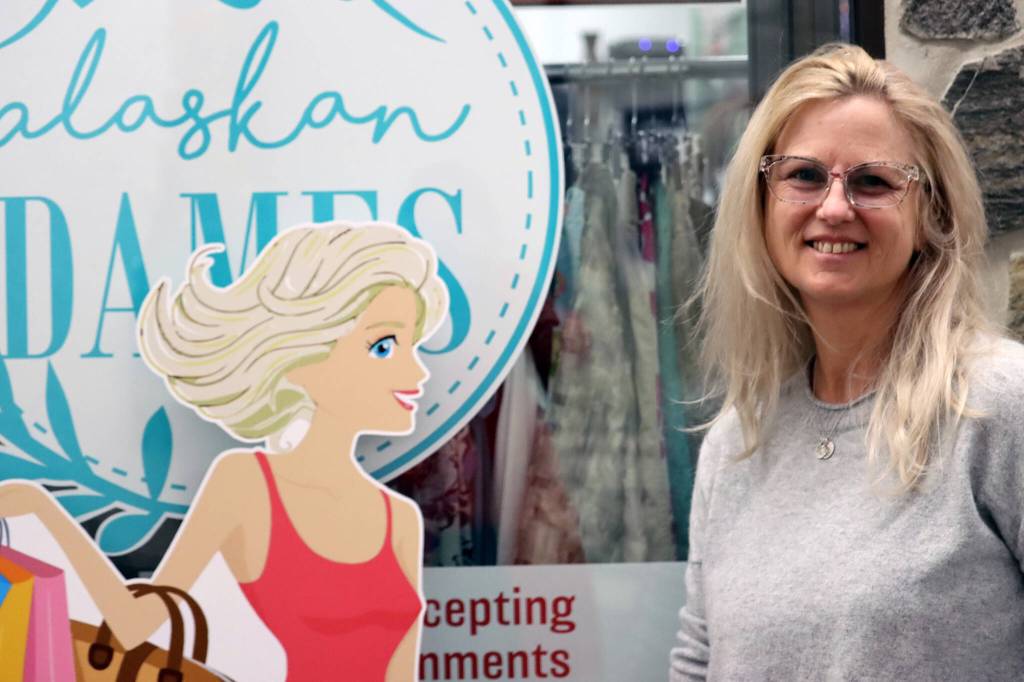 Lisa Ibias, owner of Alaskan Dames, stands outside her store at the Mendenhall Mall on Nov. 24. She recently relocated the upscale resale clothing and home decor shop back to the Mendenhall Mall. Ibias said that security and the family friendly atmosphere were crucial considerations in her return. (Dana Zigmund/Juneau Empire)